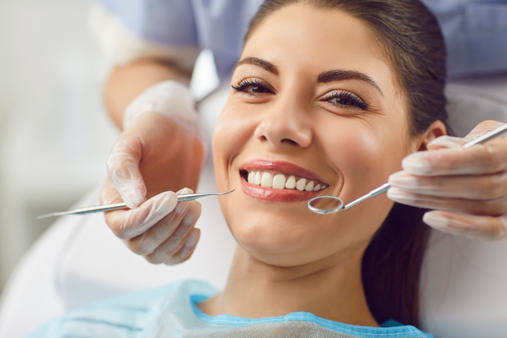 woman smiling at dentist on east hastings